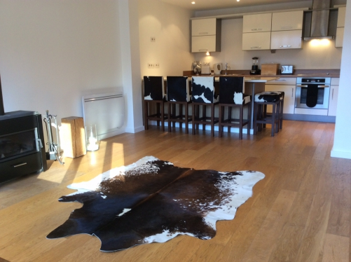 Black and white cowhide stools.