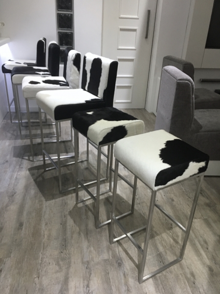 black and white cowhide bar stools with steel frames