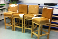 4-tan-cowhide-stools