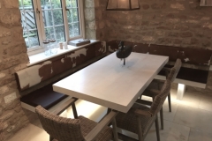 cowhide backrests and leather seating for dining area.