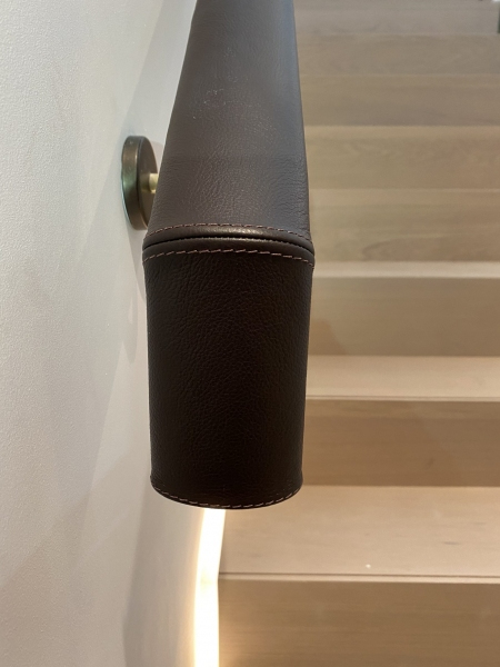 Downturn on leather handrails completed on-site by Hide and Stitch.