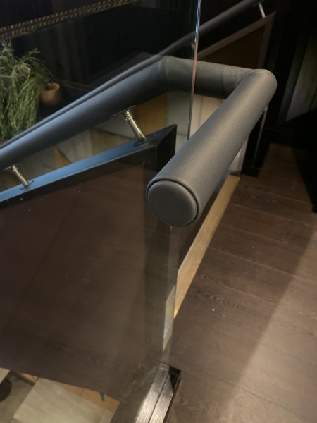 Leather applied to existing handrails at The Gaucho Restaurant, London.