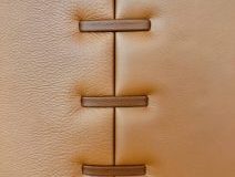 Leather pillar with leather stitch detail on large pillar.