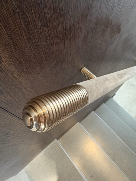 bespoke brass finials and handrails.