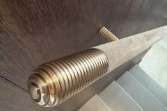 bespoke brass finials and handrails.