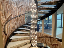 Curving leather handrails finished on-site in a stunning south coast refurb.