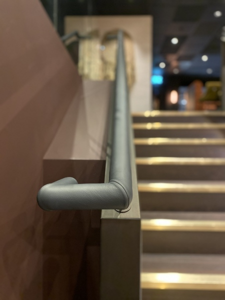 Round grey leather handrail in London Gaucho Restaurant