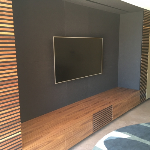 leather wall panels with walnut wood surround