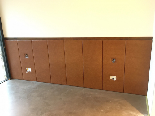 Leather Headboard Wall with sockets and light fittings.