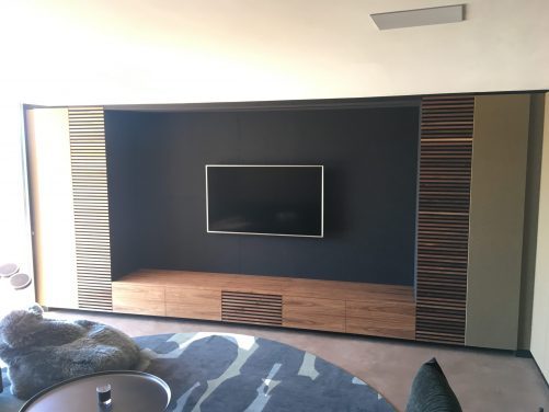 Feature TV wall with leather panels.