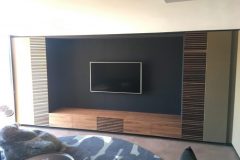 Feature TV wall with leather panels.