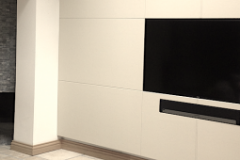 Leather wall panels surrounding TV and audio equipment.