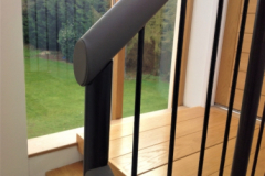 Leather handrail on spindles.