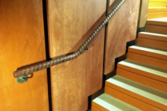 Tennis racket wrapped handrail.