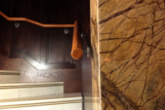 Round leather end caps on handrail