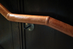 Wall mounted leather handrail