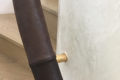 leather handrails on brass brackets