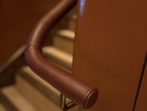 Colour drench leather handrail with walls.
