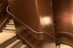 Our team fit leather on to these continuous inside and outside wall handrails on-site in Notting Hill.