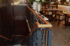 Tan leather handrail in Dover Street, London Restaurant