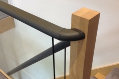 Flat handrail covered in leather.