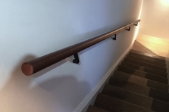 Brown leather applied to handrail in Chelsea apartments