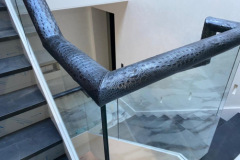 Jumbo croc print leather handrail.