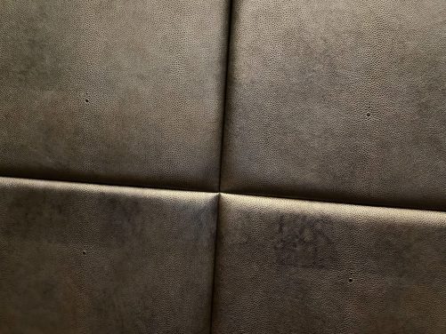 Gold and black shagreen padded panels.