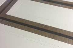 leather panels with stitch detail on drawer fronts.