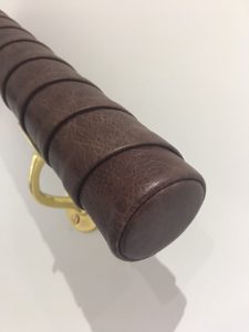 Tennis racket wrapped handrail in leather