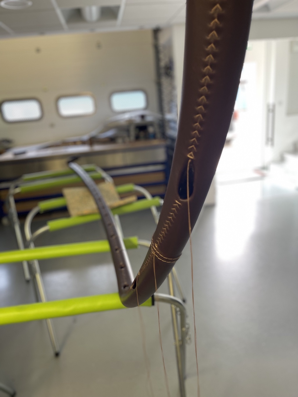 handstitch on handrail Hand stitch detail on curving handrail.